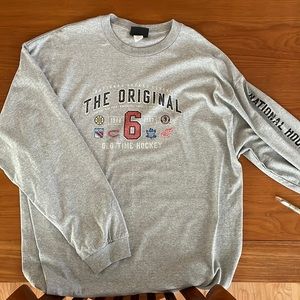 Like new long sleeve tee shirt with Original Six hockey teams.